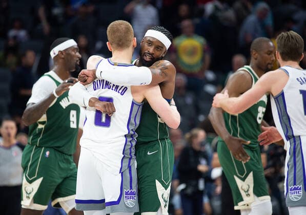 March 16, 2022, Sacramento, CA, USA: Sacramento Kings guard Donte DiVincenzo (0) hugs former teammate Milwaukee Bucks guard Wesley Matthews (23) after a game at the Golden 1 Center in Sacramento, Wednesday, March 16, 2022. Sacramento USA - ZUMAj89_ 20220316_zaf_j89_028 Copyright: xPaulxKitagakixJr.x