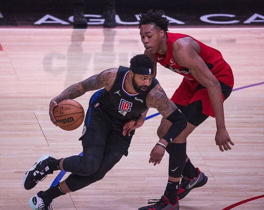March 16, 2022, Los Angeles, California, USA: Marcus Morris 8 of the Los Angeles Clippers takes possession of the ball as Scottie Barnes 4 of the Toronto Raptors defends during their NBA, Basketball Herren, USA game on Wednesday March 16, 2022 at the Crypto.com Arena in Los Angeles, California. Clippers lose to Raptors, 100-103. ARIANA RUIZ PI Los Angeles USA - ZUMAp124 20220316_zaa_p124_014 Copyright: xArianaxRuizx