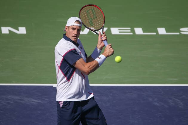 INDIAN WELLS, CA - MARCH 16: John Isner (USA) hits a volley during the BNP Paribas Open on March 16, 2022 at Indian Wells Tennis Garden in Indian Wells, CA. (Photo by George Walker Icon Sportswire) TENNIS: MAR 16 BNP Paribas Open Icon220316062