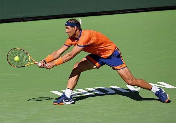 INDIAN WELLS, CA - MARCH 16: Rafael Nadal of Spain chases after and returns the ball during a tennis match played on March 16, 2022 at the BNP Paribas Open at the Indian Wells Tennis Garden in Indian Wells, CA. (Photo by John Cordes Icon Sportswire) TENNIS: MAR 16 BNP Paribas Open Icon506220316031