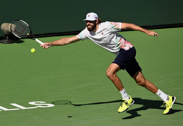 INDIAN WELLS, CA - MARCH 16: Reilly Opelka of the United States chases after the ball during a tennis match played on March 16, 2022 at the BNP Paribas Open at the Indian Wells Tennis Garden in Indian Wells, CA. (Photo by John Cordes Icon Sportswire) TENNIS: MAR 16 BNP Paribas Open Icon506220316036