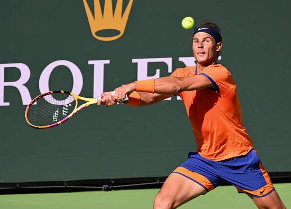 INDIAN WELLS, CA - MARCH 16: Rafael Nadal of Spain returns the ball during a tennis match played on March 16, 2022 at the BNP Paribas Open at the Indian Wells Tennis Garden in Indian Wells, CA. (Photo by John Cordes Icon Sportswire) TENNIS: MAR 16 BNP Paribas Open Icon506220316038