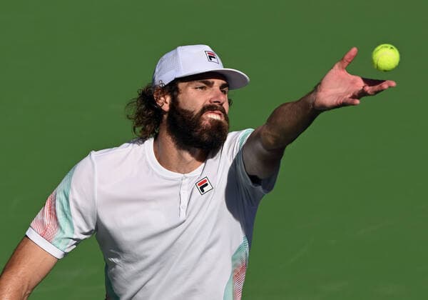 INDIAN WELLS, CA - MARCH 16: Reilly Opelka of the United States serving during a tennis match played on March 16, 2022 at the BNP Paribas Open at the Indian Wells Tennis Garden in Indian Wells, CA. (Photo by John Cordes Icon Sportswire) TENNIS: MAR 16 BNP Paribas Open Icon506220316047