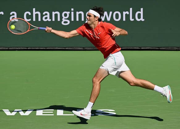 INDIAN WELLS, CA - MARCH 16: Taylor Fritz of the United States chases after and returns the ball during a tennis match played on March 16, 2022 at the BNP Paribas Open at the Indian Wells Tennis Garden in Indian Wells, CA. (Photo by John Cordes Icon Sportswire) TENNIS: MAR 16 BNP Paribas Open Icon506220316064
