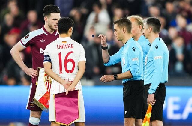 Mandatory Credit: Photo by Jed Leicester Shutterstock (12853355w) referee Clement Turpin tosses the coin as Declan Rice of West Ham United and Jesus Navas of Sevilla look on West Ham United v Sevilla, UEFA Europa League, Round of 16, 2nd Leg, Football, The London Stadium, London, UK - 17 Mar 2022 West Ham United v Sevilla, UEFA Europa League, Round of 16, 2nd Leg, Football, The London Stadium, London, UK - 17 Mar 2022  Copyright: xJedxLeicester Shutterstockx 12853355w