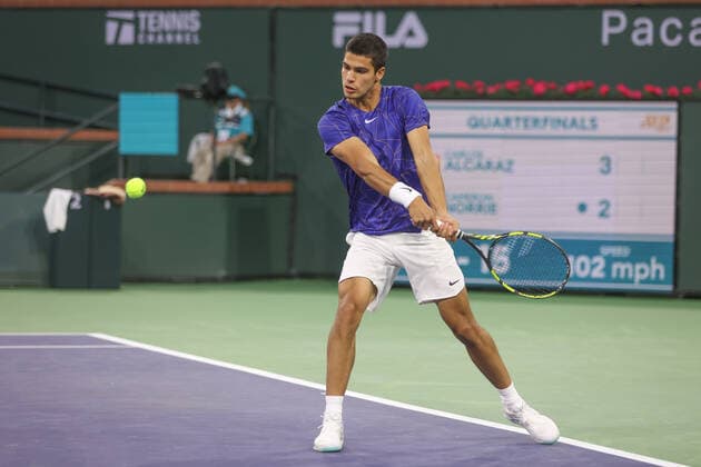 INDIAN WELLS, CA - MARCH 17: Carlos Alcaraz (ESP) hits a backhand during the quarterfinal round of the BNP Paribas Open on March 17, 2022 at Indian Wells Tennis Garden in Indian Wells, CA. (Photo by George Walker Icon Sportswire) TENNIS: MAR 17 BNP Paribas Open Icon220317132