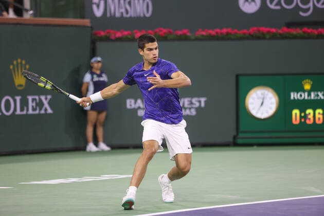 INDIAN WELLS, CA - MARCH 17: Carlos Alcaraz (ESP) hits a forehand during the quarterfinal round of the BNP Paribas Open on March 17, 2022 at Indian Wells Tennis Garden in Indian Wells, CA. (Photo by George Walker Icon Sportswire) TENNIS: MAR 17 BNP Paribas Open Icon220317140