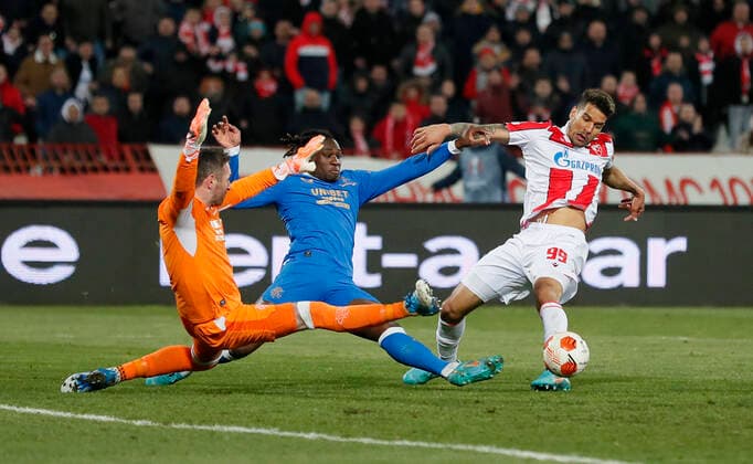 (220318) -- BELGRADE, March 18, 2022 -- Red Star Belgrade s Ohi Omoijuanfo (R) vies with Glasgow Rangers Allan McGregor (L) and Calvin Bassey during the UEFA Europa League round of 16 second leg football match between Red Star Belgrade (Crvena Zvezda) and Glasgow Rangers in Belgrade, Serbia, March 17, 2022. (Photo by Xinhua) (SP)SERBIA-BELGRADE-UEFA-EUROPA LEAGUE-RED STAR VS RANGERS PredragxMilosavljevic 