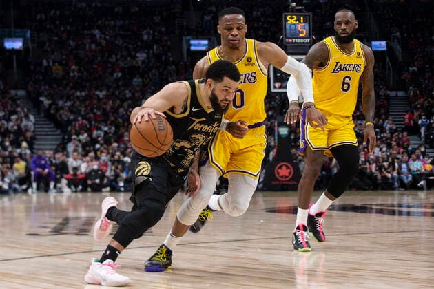 March 18, 2022, Toronto, ON, CAN: Toronto Raptors guard Fred VanVleet (left) drives past Los Angeles Lakers Russell Westbrook (centre) as Lakers LeBron James looks on during first half NBA, Basketball Herren, USA basketball action in Toronto on Friday, March 18, 2022. Fred VanVleet; Russell Westbrook; Lakers LeBron James  - ZUMAc35_ 20220318_zaf_c35_021 Copyright: xChrisxYoungx