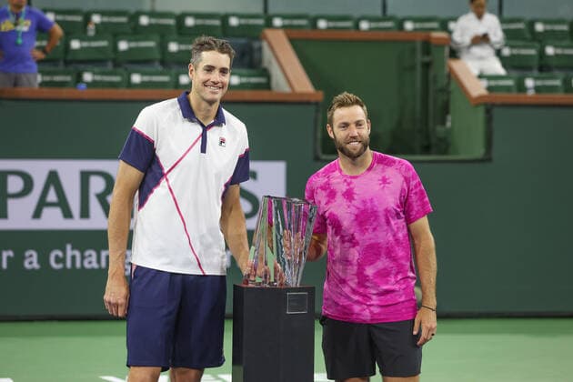 INDIAN WELLS, CA - MARCH 19: John Isner and Jack Sock of USA pose with the trophy after winning the doubles final of the BNP Paribas Open on March 19, 2022 at Indian Wells Tennis Garden in Indian Wells, CA. (Photo by George Walker Icon Sportswire) TENNIS: MAR 19 BNP Paribas Open Icon220319082