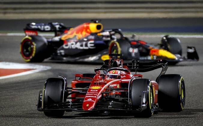 BAHRAIN - Charles Leclerc (16) driving the Ferrari in front of Max Verstappen (1) driving the Oracle Red Bull Racing RB18 Honda on track during the Bahrain F1 Grand Prix at the Bahrain International Circuit on March 20, 2022 in Bahrain, Bahrain. ANP ROBIN VAN LONKHUIJSEN Bahrain,BAHREIN xVIxANPx xxANPxIVx