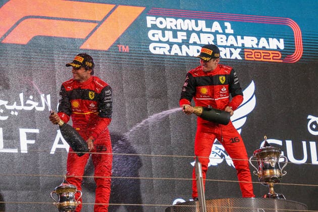 FORMULA 1 GULF AIR BAHRAIN GRAND PRIX 2022, 20 03 2022 Bahrain International Circuit, Sakhir, Bahrain on 20 March 2022 Charles Leclerc 16 (MON), Scuderia Ferrari F1-75 with Carlos Sainz 55 (SPA), Scuderia Ferrari F1-75 on podium celebrate winning during the FORMULA 1 GULF AIR BAHRAIN GRAND PRIX 2022, Phil Duncan Editorial Use Only Copyright: xPhilxDuncanx ESM-0412-0015