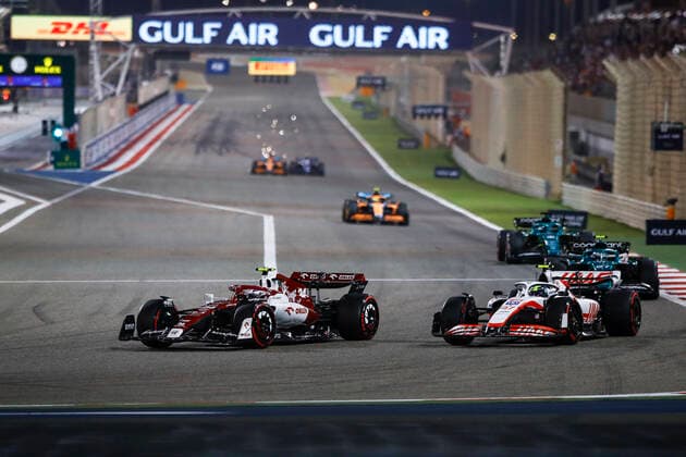 (220321) -- SAKHIR, March 21, 2022 -- Alfa Romeo s Chinese driver Zhou Guanyu (L) competes during the Bahrain Formula One Grand Prix at the Bahrain International Circuit in the city of Sakhir on March 20, 2022. (DPPI Handout via Xinhua) (SP)BAHRAIN-SAKHIR-F1-BAHRAIN GRAND PRIX 2022-FINAL WangxHaizhou 