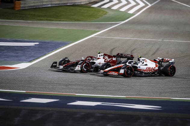 (220321) -- SAKHIR, March 21, 2022 -- Alfa Romeo s Chinese driver Zhou Guanyu (L) competes during the Bahrain Formula One Grand Prix at the Bahrain International Circuit in the city of Sakhir on March 20, 2022. (DPPI Handout via Xinhua) (SP)BAHRAIN-SAKHIR-F1-BAHRAIN GRAND PRIX 2022-FINAL WangxHaizhou 