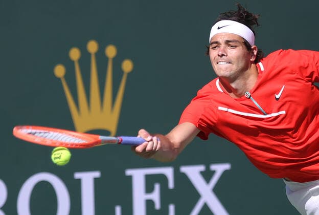 American Taylor Fritz hits a shot during his men s final match against Rafael Nadal of Spain at the BNP Paribas Open in Indian Wells, California on Sunday, March 20, 2022. Fritz defeated Nadel 6-3, 7-6 (5) to win the championship and his first ATP, Tennis Herren Masters 1000 tournament.  IDW20220320032 DAVIDxSILPA