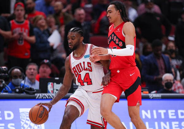 CHICAGO, IL - MARCH 21: Chicago Bulls forward Patrick Williams (44) brings the ball up court while being defended by Toronto Raptors guard Dalano Banton (45) during a NBA, Basketball Herren, USA game between the Toronto Raptors and the Chicago Bulls on March 21, 2022 at the United Center in Chicago, IL. (Photo by Melissa Tamez Icon Sportswire) NBA: MAR 21 Raptors at Bulls Icon22032143