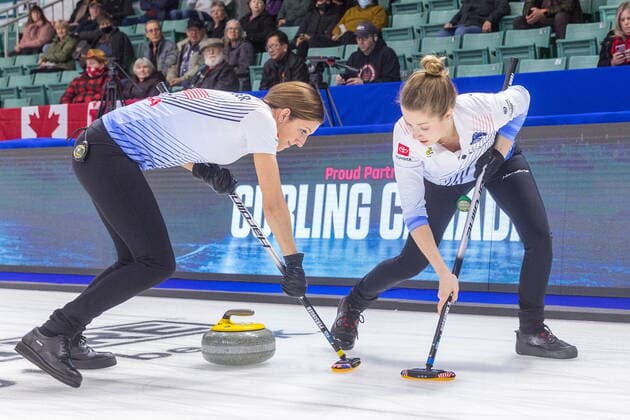 March 22, 2022, Prince George, BC, Canada: Team United States second Vicky Persinger, left, and third Sarah Anderson sweep in front of a stone at CN Centre on Tuesday afternoon during at the Women s World Curling in Prince George, B.C., on Tuesday, March 22, 2022. Canada News - March 22, 2022 - ZUMAc35_ 20220322_zaf_c35_148 Copyright: xJamesxDoylex