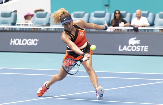 Naomi Osaka, from Japan returns a forehand shot to Astra Sharma from Australia at the Miami Open in the Hard Rock Stadium in Miami Gardens, Florida, Wednesday, on March 23, 2022. Osaka defeated Shama 6-3, 6-4.  MIA20220323121 GARYxIxROTHSTEIN