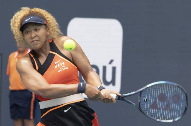 Naomi Osaka, from Japan hits a backhand shot back to Astra Sharma from Australia at the Miami Open in the Hard Rock Stadium in Miami Gardens, Florida, Wednesday, on March 23, 2022. Osaka defeated Shama 6-3, 6-4.  MIA20220323129 GARYxIxROTHSTEIN