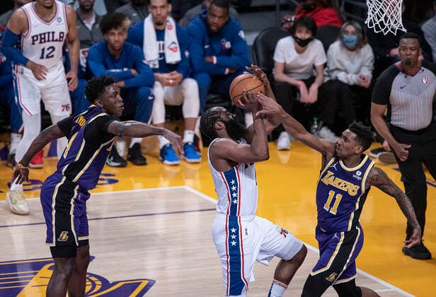 March 23, 2022, Los Angeles, California, USA: James Harden 1 of the Philadelphia 76ers is blocked by Malik Monk 11 of the Los Angeles Lakers as he puts up a layup during their NBA, Basketball Herren, USA game on Wednesday March 23, 2022 at Crypto.com Arena in Los Angeles, California. PI Los Angeles USA - ZUMAp124 20220323_zaa_p124_014 Copyright: xJAVIERxROJASx
