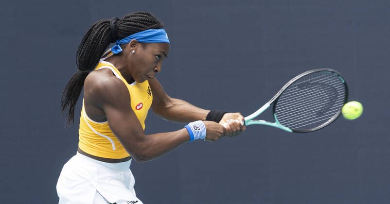 Cori Gauff from the USA returns a two handed backhand shot to Qiang Wang from China at the Miami Open in the Hard Rock Stadium in Miami Gardens, Florida, on Friday, March 25, 2022. Gauff defeated Wang 7-5, 6-4.  MIA20220325101 GARYxIxROTHSTEIN