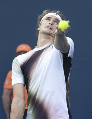 Alexander Zverev from Germany serves to Borna Coric from Croatia at the Miami Open in the Hard Rock Stadium in Miami Gardens, Florida, on Friday, March 25, 2022. Zverev defeated Coric 6-4, 3-6, 6-4 in three sets.  MIA20220325113 GARYxIxROTHSTEIN