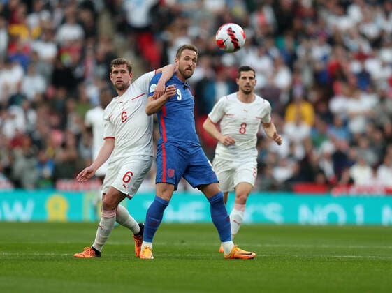 England v Switzerland International Football 26 March 2022 Wembley, International Football Friendly match, England v Switzerland - Harry Kane of England contests the ball with Fabian Frei of Switzerland. (Photo by Mark Leech). London UK Copyright: xMarkxLeechxOffside