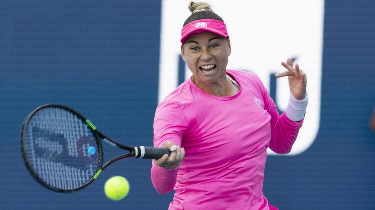 Vera Zvonareva from Russia returns a forehand shot to Danielle Collins from the USA at the Miami Open in the Hard Rock Stadium in Miami Gardens, Florida, on Saturday, March 26, 2022. Collins defeated Zvonareva 6-1, 6-4.  MIA20220326116 GARYxIxROTHSTEIN