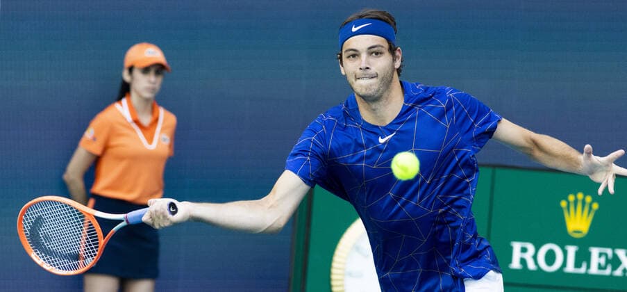 Taylor Fritz from the USA reaches for a forehand shot to Mikhail Kulushkin from Kazakhstan at the Miami Open in the Hard Rock Stadium in Miami Gardens, Florida, on Saturday, March 26, 2022. Fritz defeated Kulushkin 6-3, 5-7, 6-3.  MIA20220326127 GARYxIxROTHSTEIN