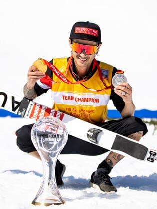 SKI FLYING - FIS WC Planica PLANICA,SLOVENIA,27.MAR.22 - NORDIC SKIING, Ski jumping, Skispringen, Ski, nordisch SKI FLYING - FIS World Cup. Image shows the rejoicing of Manuel Fettner (AUT). Keywords: trophy, medals.  GEPAxpictures xMaticxKlansek