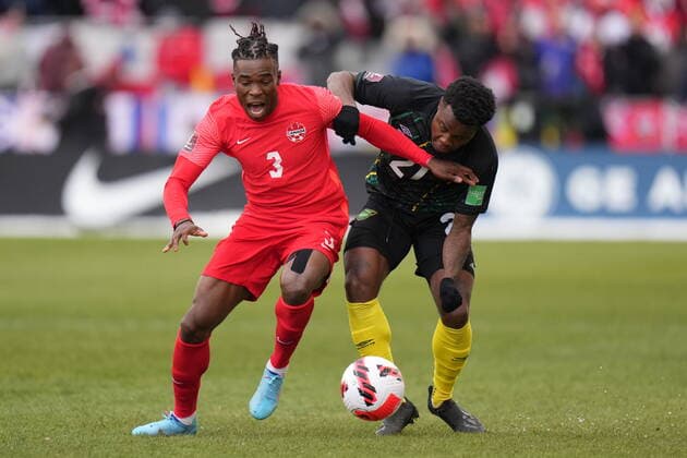 March 27, 2022, TORONTO, ON, CANADA: Canada s Sam Adekugbe and Jamaica s Javain Brown battle for ther ball during first half CONCACAF World Cup soccer qualifying action in Toronto on Sunday, March 27, 2022. Canada News - March 27, 2022  - ZUMAc35_ 20220327_zaf_c35_081 Copyright: xNathanxDenettex