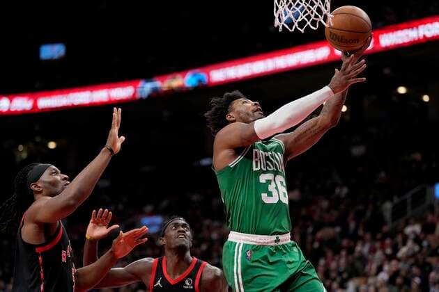 March 28, 2022, Toronto, ON, CANADA: Boston Celtics guard Marcus Smart (36) goes for the layup as Toronto Raptors forward Precious Achiuwa (5) and teammate Pascal Siakam (43) look on during first half NBA, Basketball Herren, USA basketball action in Toronto, Monday, March 28, 2022. Celtics at Raptors NBA  - ZUMAc35_ 20220328_zaf_c35_068 Copyright: xFrankxGunnx