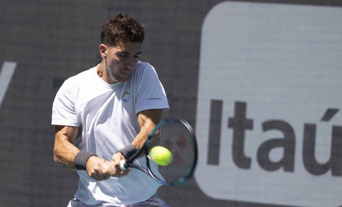 Thanasi Kokkinakis from Australia returns a two handed backhand to Alexander Zverev from Germany at the Miami Open in the Hard Rock Stadium in Miami Gardens, Florida, on Tuesday, March 29, 2022. Zverev defeated Kokkinakis 6-4, 6-4.  MIA20220329103 GARYxIxROTHSTEIN