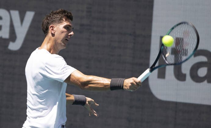 Thanasi Kokkinakis from Australia returnsa backhand shot to Alexander Zverev from Germany at the Miami Open in the Hard Rock Stadium in Miami Gardens, Florida, on Tuesday, March 29, 2022. Zverev defeated Kokkinakis 6-4, 6-4.  MIA20220329109 GARYxIxROTHSTEIN