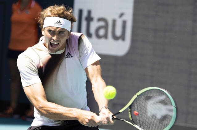 Alexander Zverev from Germany returns a two handed backhand shot to Thanasi Kokkinakis from Australia at the Miami Open in the Hard Rock Stadium in Miami Gardens, Florida, on Tuesday, March 29, 2022. Zverev defeated Kokkinakis 6-4, 6-4.  MIA20220329105 GARYxIxROTHSTEIN