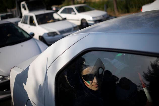 Female Fans, Iran, World Cup An Iranian soccer female fan with an Iran flag on her face sits at a vehicle as she arrives the Azadi (Freedom) stadium in western Tehran, October 10, 2019. Despite the Iranian sports ministry making tickets for Iranian female soccer fans for the March 29th match between Iran and Lebanon, they were denied entry, making the Iranian football federation fear they will be banned from the 2022 World Cup in Qatar. Tehran Tehran Iran  Copyright: xMortezaxNikoubazlx originalFilename:nikoubazl-femalefa191010_npymr.jpg