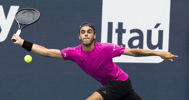 Francisco Cerundolo from Argentina stretches for a forehand shot to Casper Ruud from Norway during the semi-finals at the Miami Open in the Hard Rock Stadium in Miami Gardens, Florida, on Friday, April 1, 2022. Ruud defeated Cerundolo 6-4, 6-1 to advance to the finals.  MIA20220401122 GARYxIxROTHSTEIN