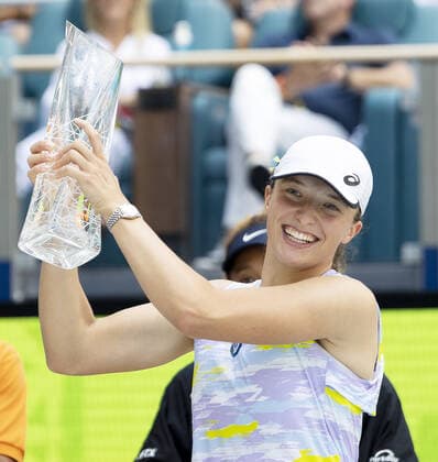 Iga Swiatek from Poland holds the winning trophy after defeating Naomi Osaka from Japan during the women s finals at the Miami Open in the Hard Rock Stadium in Miami Gardens, Florida, on Saturday, April 2, 2022. Swiatek defeated Osaka 6-4, 6-0 winning the women s championship.  MIA20220402114 GARYxIxROTHSTEIN