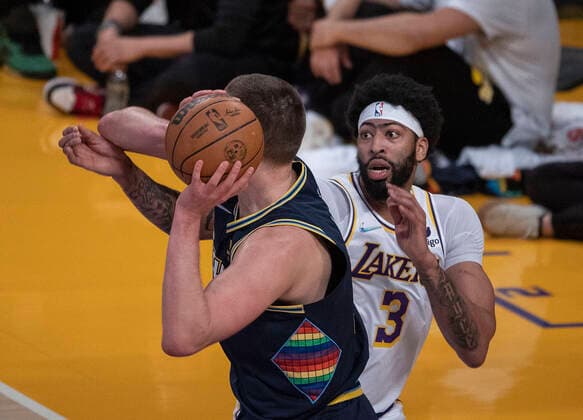 Anthony Davis 3 of the Los Angeles Lakers defends against Nikola Jokic 15 of the Denver Nuggets during their NBA, Basketball Herren, USA game on Sunday April 3, 2022 at Crypto.com Arena in Los Angeles, California. Lakers vs. Nuggets !ACHTUNG: NUR REDAKTIONELLE NUTZUNG!  Copyright: xJAVIERxROJAS EFEx AME8580 20220403-8dcff2cd90b931f7a612a5c860e9d80f87108480