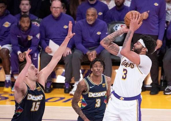 Anthony Davis 3 of the Los Angeles Lakers puts a shot over Nikola Jokic 15 of the Denver Nuggets during their NBA, Basketball Herren, USA game on Sunday April 3, 2022 at Crypto.com Arena in Los Angeles, California. Lakers vs. Nuggets !ACHTUNG: NUR REDAKTIONELLE NUTZUNG!  Copyright: xJAVIERxROJAS EFEx AME8587 20220403-c0b9e6390beff8440be542c7d44fb32fbc999a10