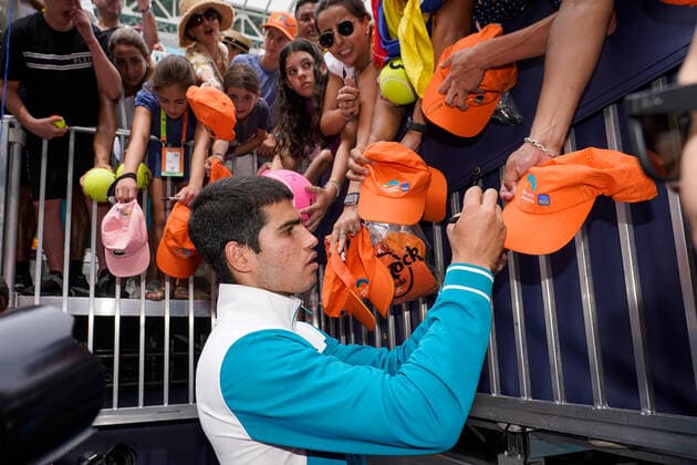 MIAMI GARDENS, FL - APRIL 3: Carlos Alcaraz signs autographs for fans after winning the Men s Final of the Miami Open on APRIL 3, 2022 at Hard Rock Stadium in Miami Gardens, FL. (Photo by Aaron Gilbert Icon Sportswire) TENNIS: APR 03 Miami Open Icon22040324714