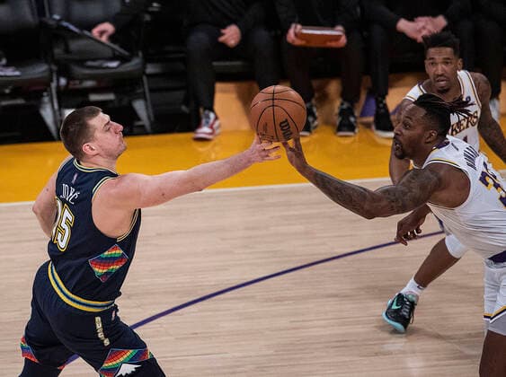 April 3, 2022, Los Angeles, California, USA: Dwight Howard 39 of the Los Angeles Lakers and Nikola Jokic 15 of the Denver Nuggets go for the ball during their NBA, Basketball Herren, USA game on Sunday April 3, 2022 at Crypto.com Arena in Los Angeles, California. Lakers lose to Nuggets, 118-129. PI Los Angeles USA - ZUMAp124 20220403_zaa_p124_004 Copyright: xJAVIERxROJASx