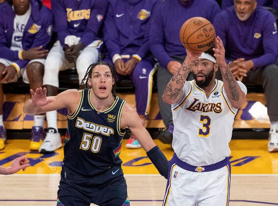 April 3, 2022, Los Angeles, California, USA: Anthony Davis 3 of the Los Angeles Lakers looks to pass the ball away from Aaron Gordon 50 of the Denver Nuggets during their NBA, Basketball Herren, USA game on Sunday April 3, 2022 at Crypto.com Arena in Los Angeles, California. Lakers lose to Nuggets, 118-129. PI Los Angeles USA - ZUMAp124 20220403_zaa_p124_015 Copyright: xJAVIERxROJASx