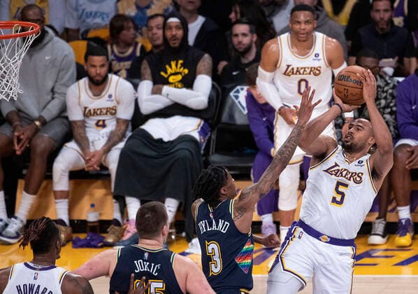 April 3, 2022, Los Angeles, California, USA: Talen Horton-Tucker 5 of the Los Angeles Lakers puts a shot over NahÃ¢â‚¬â ¢Shon Hyland 3 of the Denver Nuggets during their NBA, Basketball Herren, USA game on Sunday April 3, 2022 at Crypto.com Arena in Los Angeles, California. Lakers lose to Nuggets, 118-129. PI Los Angeles USA - ZUMAp124 20220403_zaa_p124_016 Copyright: xJAVIERxROJASx