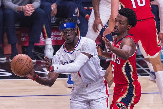April 3, 2022, Los Angeles, California, USA: Reggie Jackson 1 of the Los Angeles Clippers passes the ball away from Herbert Jones 5 of the New Orleans Pelicans during their NBA, Basketball Herren, USA game on Sunday April 3, 2022 at Crypto.com Arena in Los Angeles, California. Clippers defeat Pelicans, 119-100. ARIANA RUIZ PI Los Angeles USA - ZUMAp124 20220403_zaa_p124_063 Copyright: xArianaxRuizx