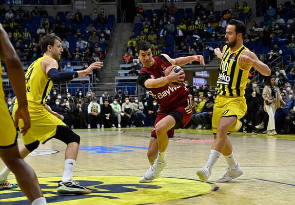 Jan Vesely (L) , Melih Mahmutoglu (R) of Fenerbahce Beko Istanbul and Nihad Dedovic of Bayerm Munich in action during the Turkish Airlines EuroLeague Regular Season Round 26 match between Fenerbahce Beko Istanbul and Bayerm Munich at Ulker Sports Arena in Istanbul, Turkey, on April 4, 2022. ( Photo : Seskimphoto ) 