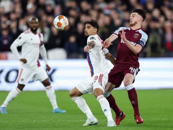 Mandatory Credit: Photo by Simon Dael Shutterstock (12885077al) Lucas Paqueta of Lyon and Declan Rice of West Ham United West Ham United v Olympique Lyonnais, UEFA Europa League, Quarter Final, First Leg, Football, The London Stadium, London, UK - 07 Apr 2022 EDITORIAL USE ONLY No use with unauthorised audio, video, data, fixture lists, club league logos or live services. Online in-match use limited to 120 images, no video emulation. No use in betting, games or single club league player publications. West Ham United v Olympique Lyonnais, UEFA Europa League, Quarter Final, First Leg, Football, The London Stadium, London, UK - 07 Apr 2022 EDITORIAL USE ONLY No use with unauthorised audio, video, data, fixture lists, club league logos or live services. Online in-match use limited to 120 images, no video emulation. No use in betting, games or single club league player publications. Copyright: xSimonxDael Shutterstockx 12885077al