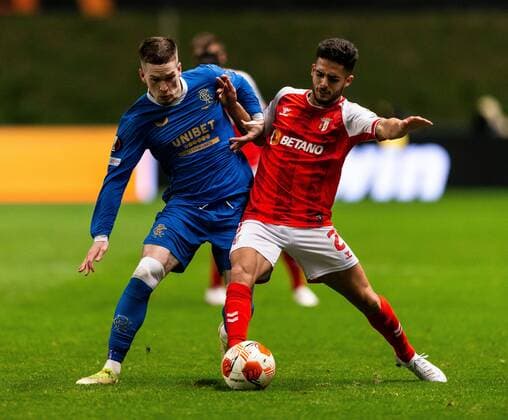 Mandatory Credit: Photo by Luke Nickerson Rangers FC Shutterstock (12885361y) Ryan Kent of Rangers battles for the ball with Braga Defender Yan Couto during the Europa League quarter final match at the Municipal Stadium, Braga. Braga v Rangers, UEFA Europa League, Quarter Final, First Leg, Football, Estadio Municipal de Braga, Braga, Portugal - 07 Apr 2022 EDITORIAL USE ONLY No use with unauthorised audio, video, data, fixture lists, club league logos or live services. Online in-match use limited to 120 images, no video emulation. No use in betting, games or single club league player publications. Braga v Rangers, UEFA Europa League, Quarter Final, First Leg, Football, Estadio Municipal de Braga, Braga, Portugal - 07 Apr 2022 EDITORIAL USE ONLY No use with unauthorised audio, video, data, fixture lists, club league logos or live services. Online in-match use limited to 120 images, no video emulation. No use in betting, games or single club league player publications. Copyright: xLukexNickerson RangersxFC Shutterstockx 12885361y