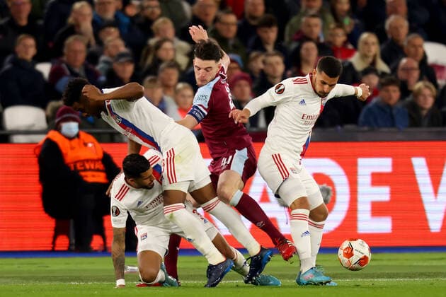 7th April 2022, London Stadium, London, England; Europa League football West Ham versus Lyon; Declan Rice of West Ham United is challenged by 3 Lyon players  ActionPlus12376338 ShaunxBrooks