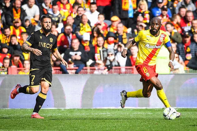 April 10, 2022, Lens, France, France: Andy DELORT of Nice and Seko FOFANA of Lens during the Ligue 1 match between RC Lens and OGC Nice at Bollaert-Delelis Stadium on April 10, 2022 in Lens, France. Lens France - ZUMAm308 20220410_zsp_m308_003 Copyright: xMatthieuxMirvillex